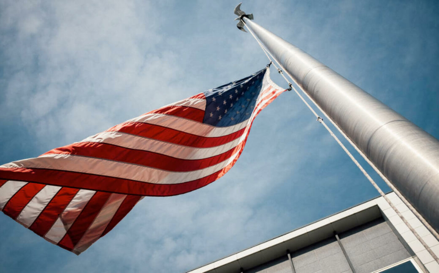 American flag waving near state property building